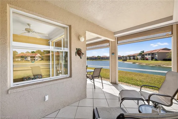 Screened Lanai / featuring gorgeous long southwestern long lake views tand upgraded diagonal tiles