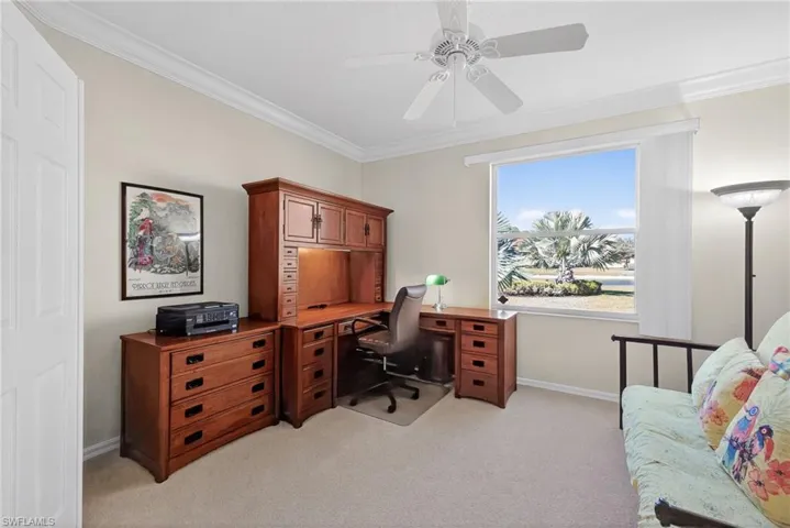 VIRTUALLY REFRESHED WITH A NEUTRAL PALETTE!  office featuring ornamental molding, ceiling fan, and light colored carpet