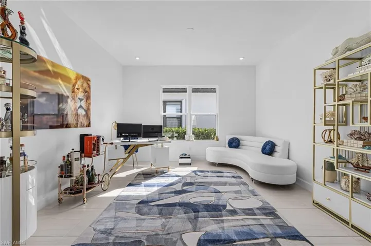 Bedroom featuring tile patterned floors, a desk, and recessed lighting