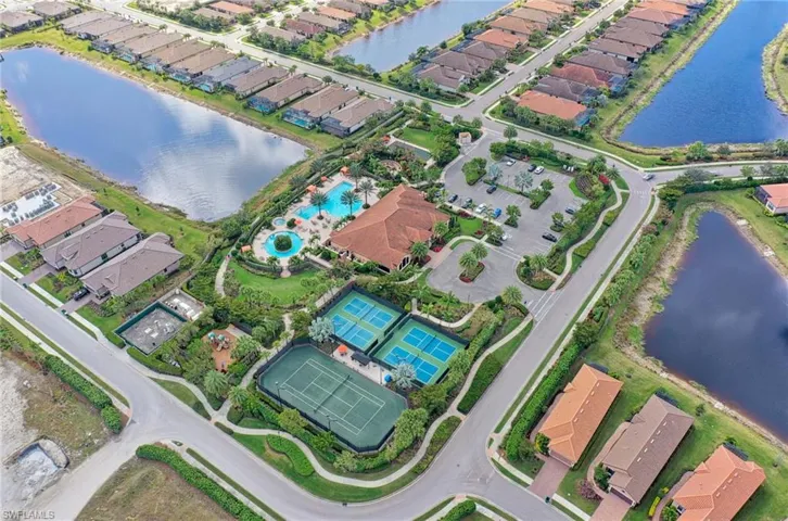 View of property location featuring a nearby body of water and nearby suburban area
