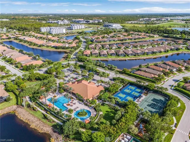 Aerial overview of property's location with a large body of water and nearby suburban area