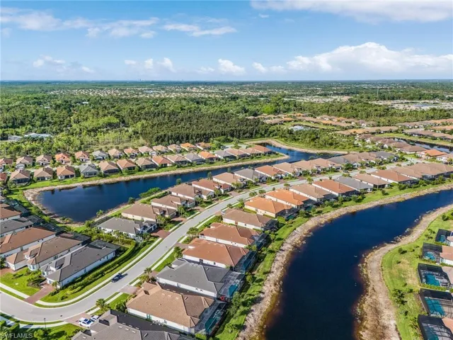 Aerial overview of property's location featuring nearby suburban area and a nearby body of water