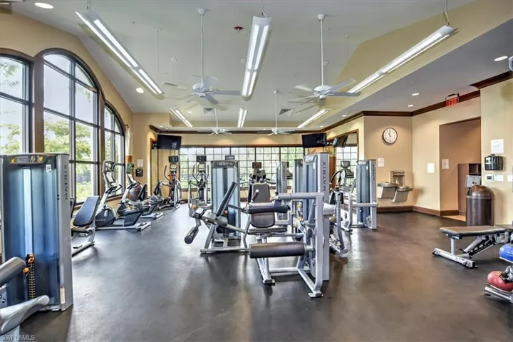 Exercise room featuring a ceiling fan, recessed lighting, and high vaulted ceiling