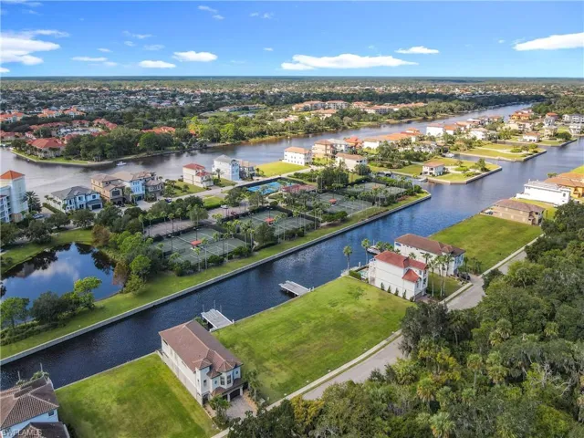 Waterfront community featuring multiple canals, lush green spaces, and established residential properties