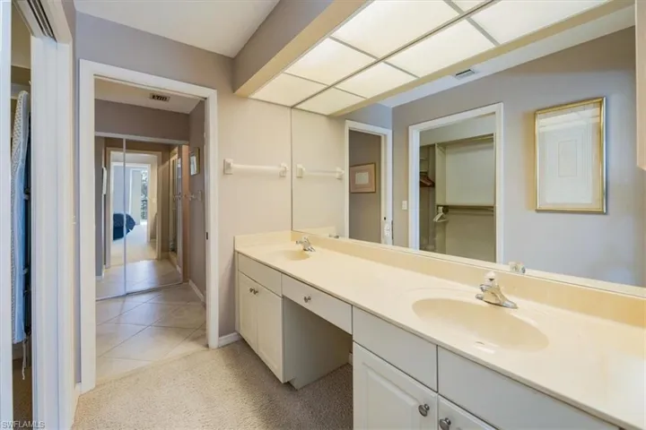 Bathroom with vanity and tile patterned floors