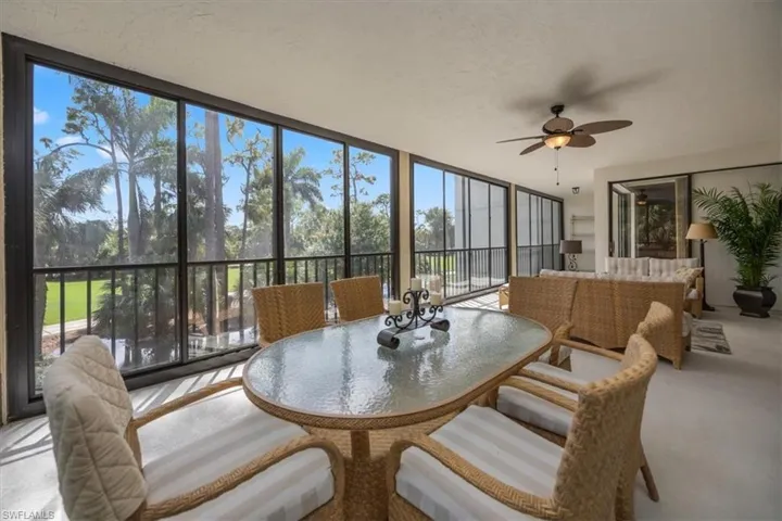 Sunroom featuring ceiling fan