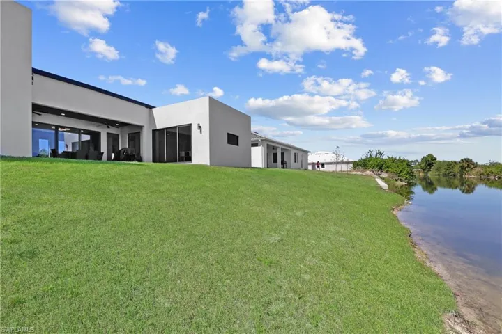 View of green lawn with a water view