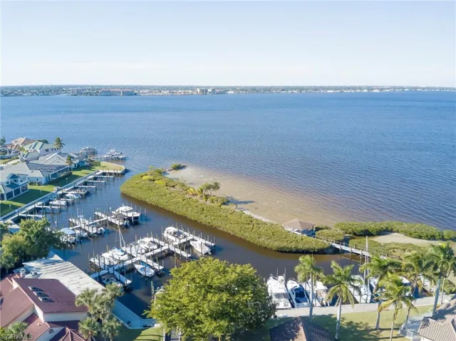 Drone / aerial view of a large body of water and numerous boat docks