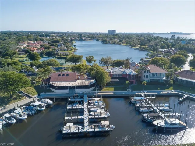 Aerial perspective of suburban area with a large body of water