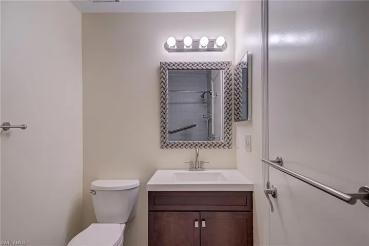 Full bathroom with a shower with curtain and vanity