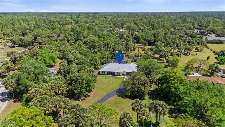 Drone / aerial view featuring a wooded view