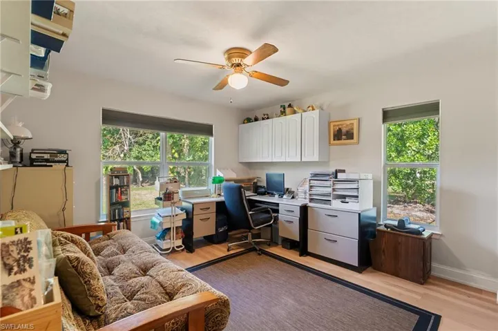 Bedroom featuring light wood finished floors, visible vents, connected bathroom, recessed lighting, and a ceiling fan