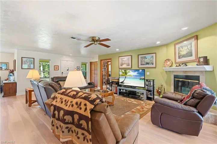 Kitchen featuring brown cabinets, appliances with stainless steel finishes, a peninsula, and light countertops
