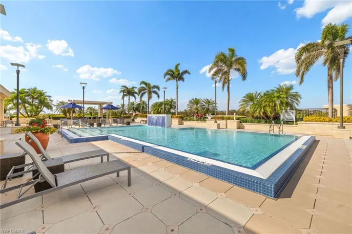 Community pool featuring a patio area
