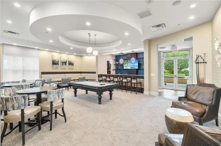 Recreation room featuring light colored carpet, visible vents, and pool table