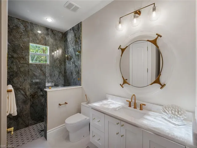 Bathroom with a walk in shower and vanity
