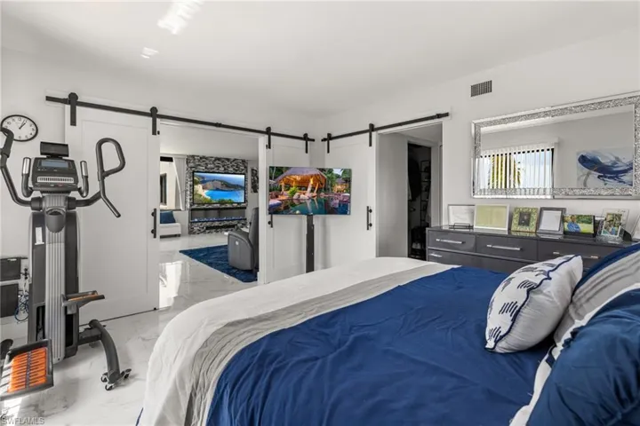 Bedroom featuring a barn door