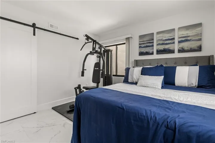 Bedroom with a barn door