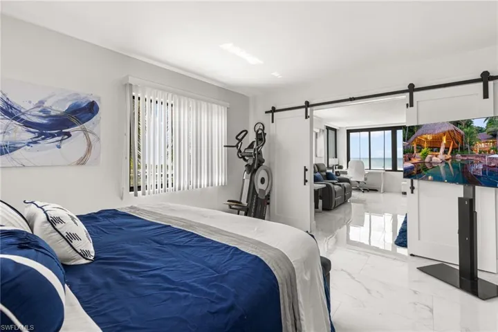 Bedroom featuring a barn door