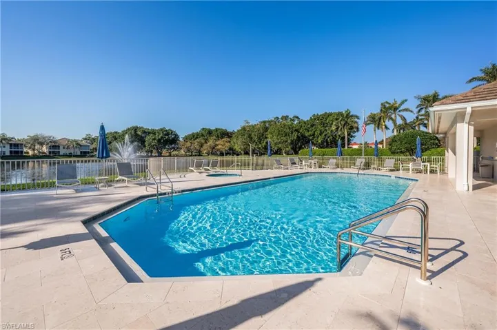 View of Seville swimming pool with a patio area