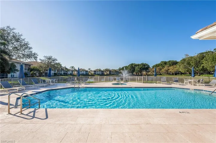 View of Seville swimming pool with a patio area