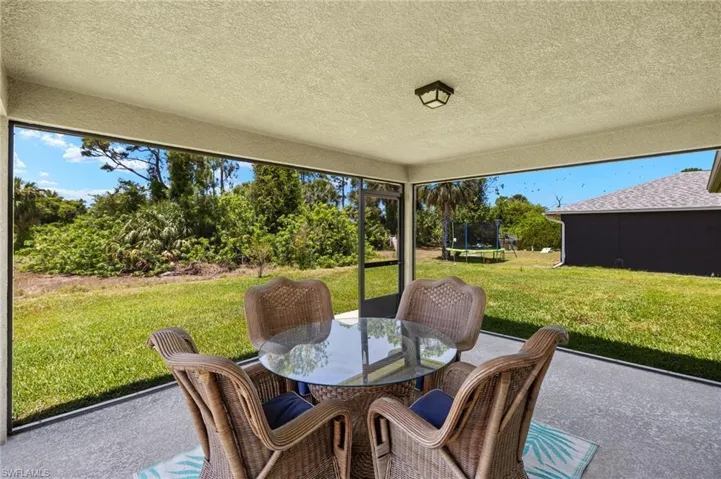 Sunroom featuring outdoor dining space