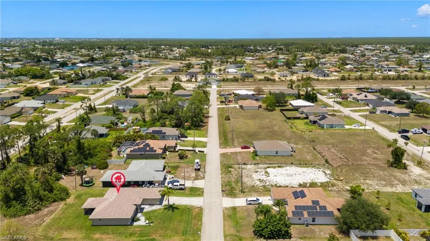 Aerial overview of property's location with nearby suburban area