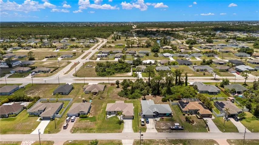 Aerial overview of property's location featuring nearby suburban area
