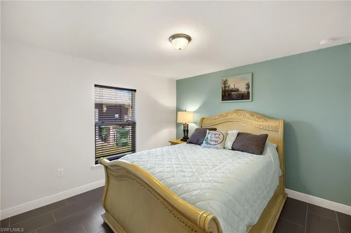 Bedroom featuring baseboards