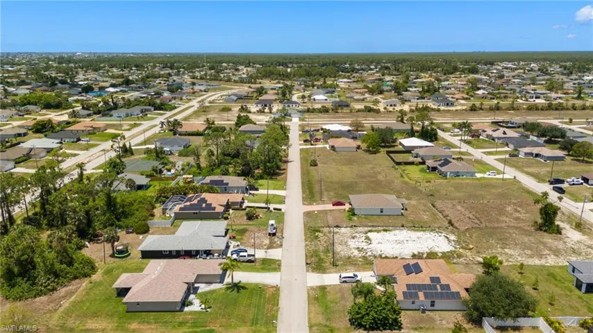 View of property location with nearby suburban area