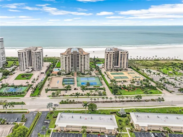 Drone / aerial view featuring a water view and a beach view