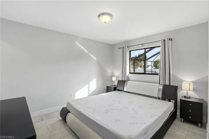 Bedroom with light tile patterned floors