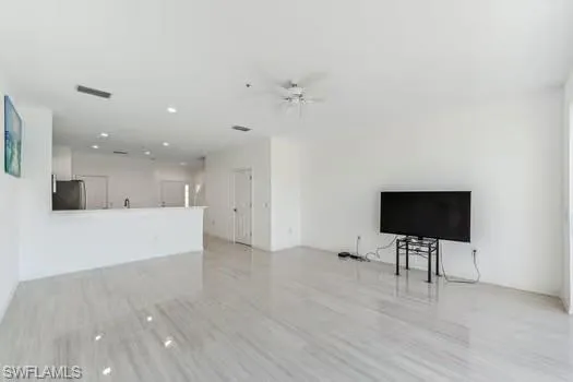 Living Room with ceiling fan, recessed lighting, and light wood-style floors