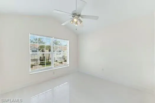 2nd Bedroom featuring lofted ceiling and a ceiling fan