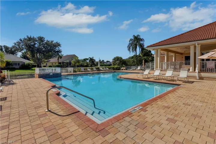 Community pool with a patio area