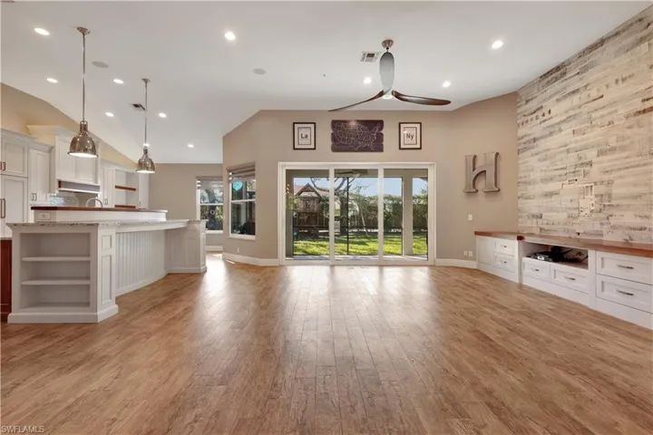 Unfurnished living room featuring light wood-type flooring, recessed lighting, and a ceiling fan
