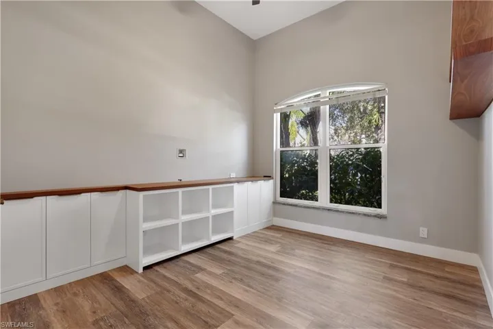 Spare room featuring light wood-style floors and a ceiling fan
