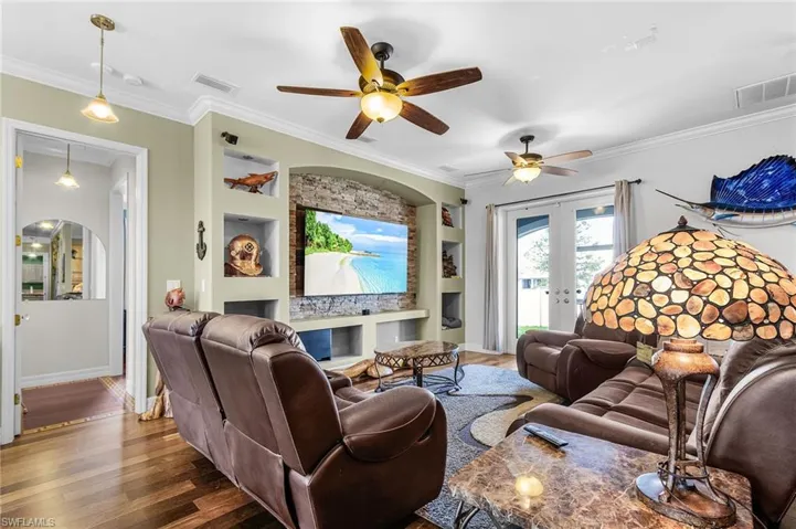 large entertainment built-ins, french doors to back patio