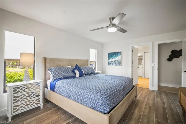 Bedroom featuring dark wood finished floors and a ceiling fan