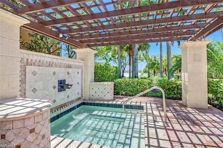 View of pool featuring a pergola, a patio area, and a community hot tub