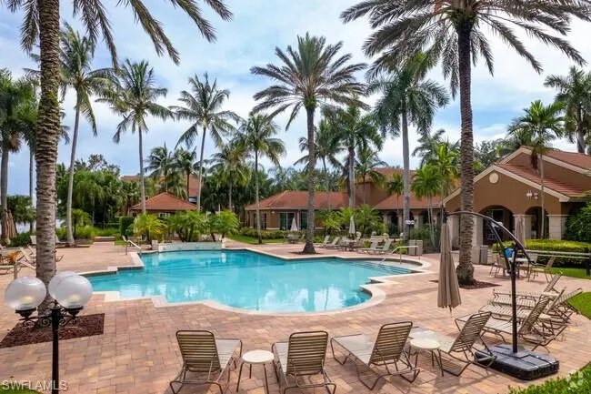 Community pool featuring a patio