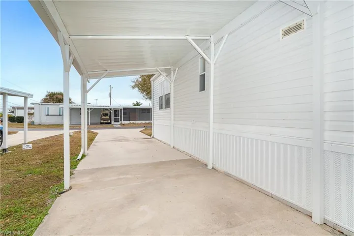 View of patio featuring an attached carport