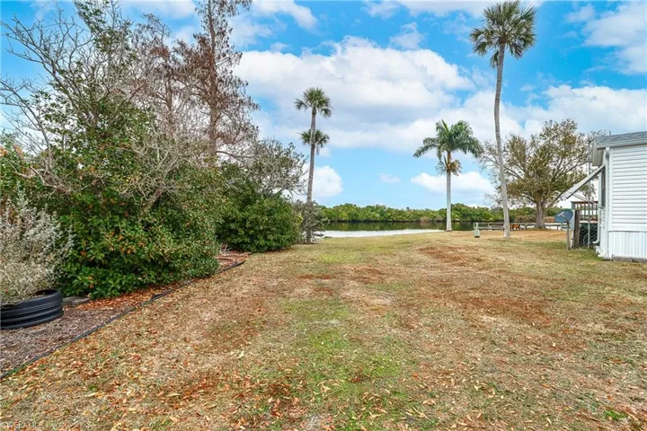 View of yard with a water view
