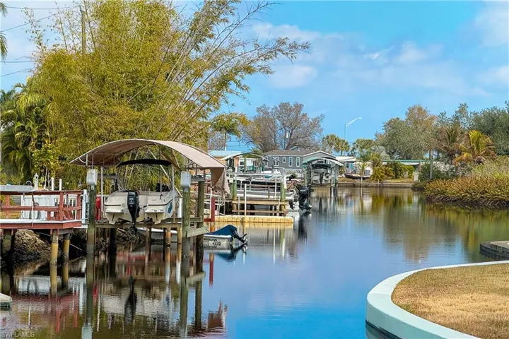 Dock with boat lift and a water view