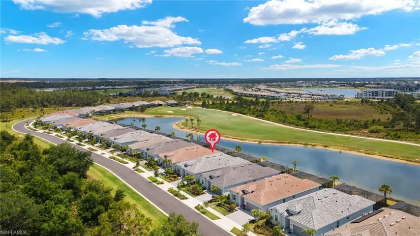Aerial view with a residential view, a water view, and golf course view