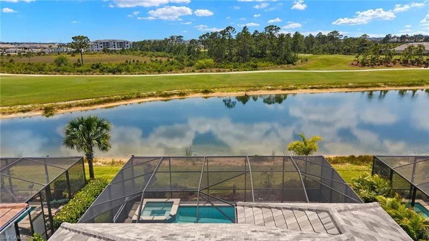 Bird's eye view featuring golf course view and a water view