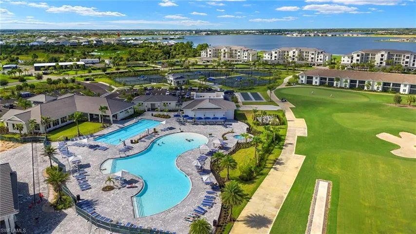 Drone / aerial view featuring view of golf course and a water view