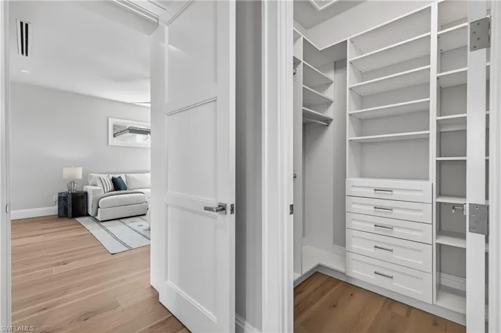 Walk in closet featuring light wood-type flooring