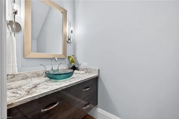 Bathroom featuring vanity and baseboards