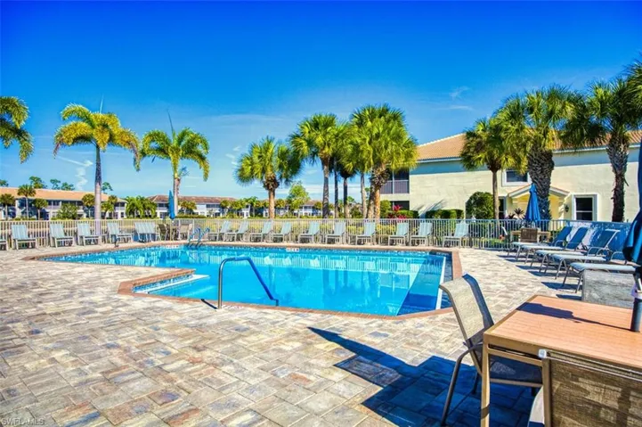 Community pool featuring a patio